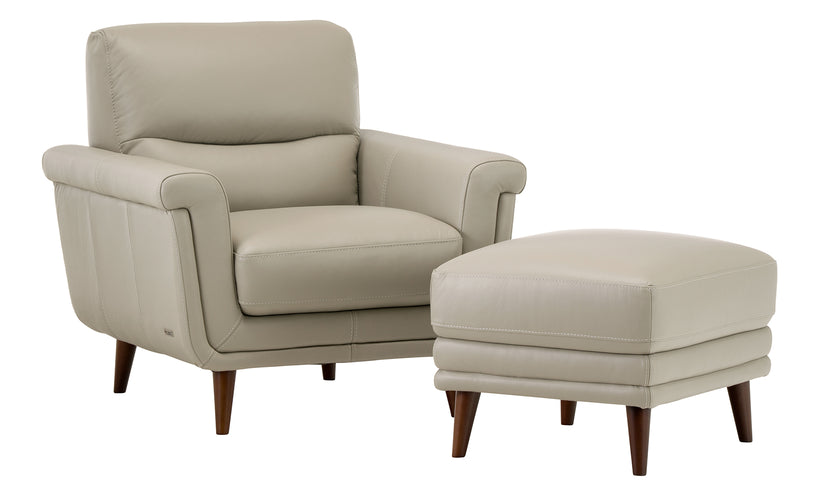 Beige armchair with matching ottoman on a white background